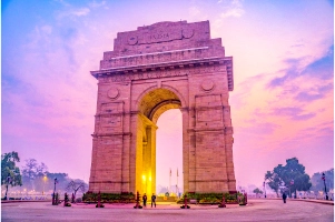 India Gate at dusk with purple sky in Delhi, India.